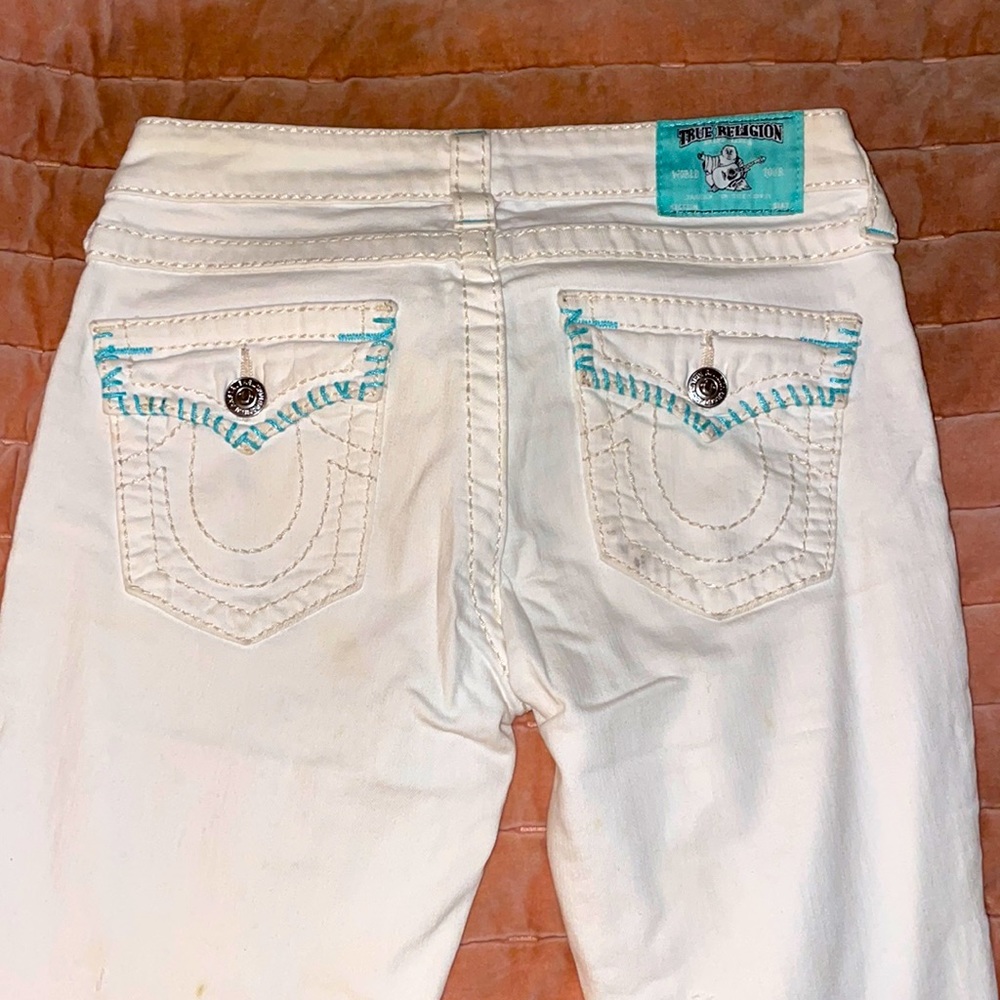 white and teal true religion jeans